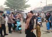 PERSONEL POLSEK KAPUAS TENGAH AMANKAN JALANNYA ACARA PERINGATAN MAULID NABI MUHAMMAD SAW 1448 H / 2026 M DI DESA PUJON