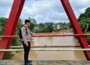 Polsek Manuhing Gencarkan Patroli, Pastikan Wilayah Rawan Genangan Air Terpantau